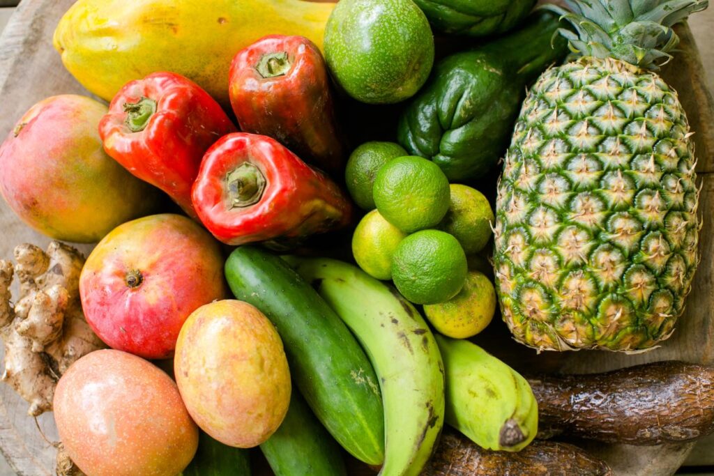 red peppers, apples, pineapples, limes, lemons, plantains, papaya, mango