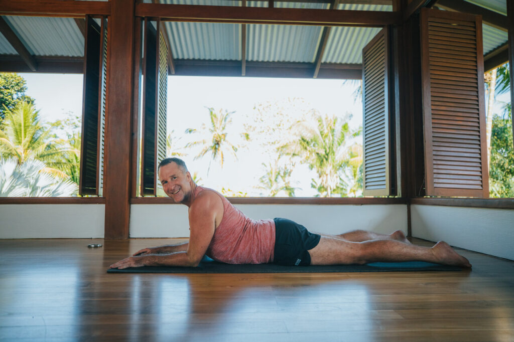 sphinx pose demonstrated by yogi aaron is one of the best yoga poses for back pain