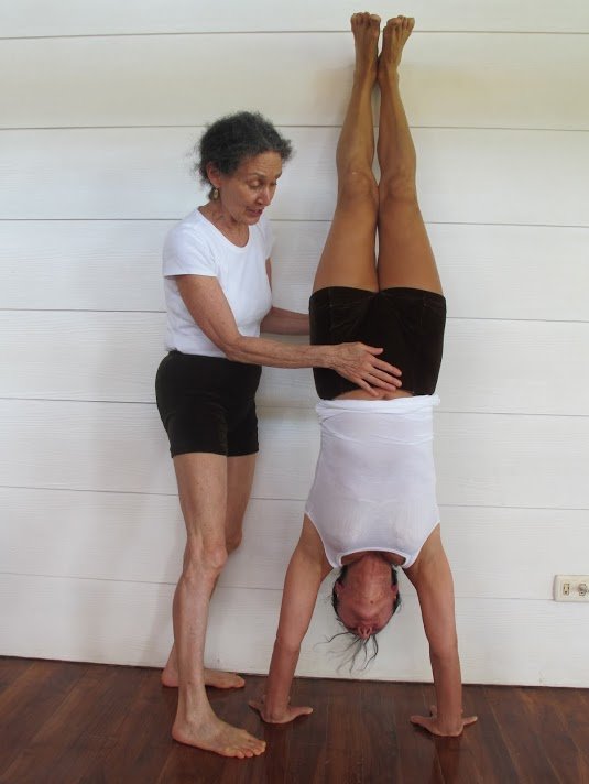 Iyengar Yoga Woman practicing Iyengar Yoga's Handstand