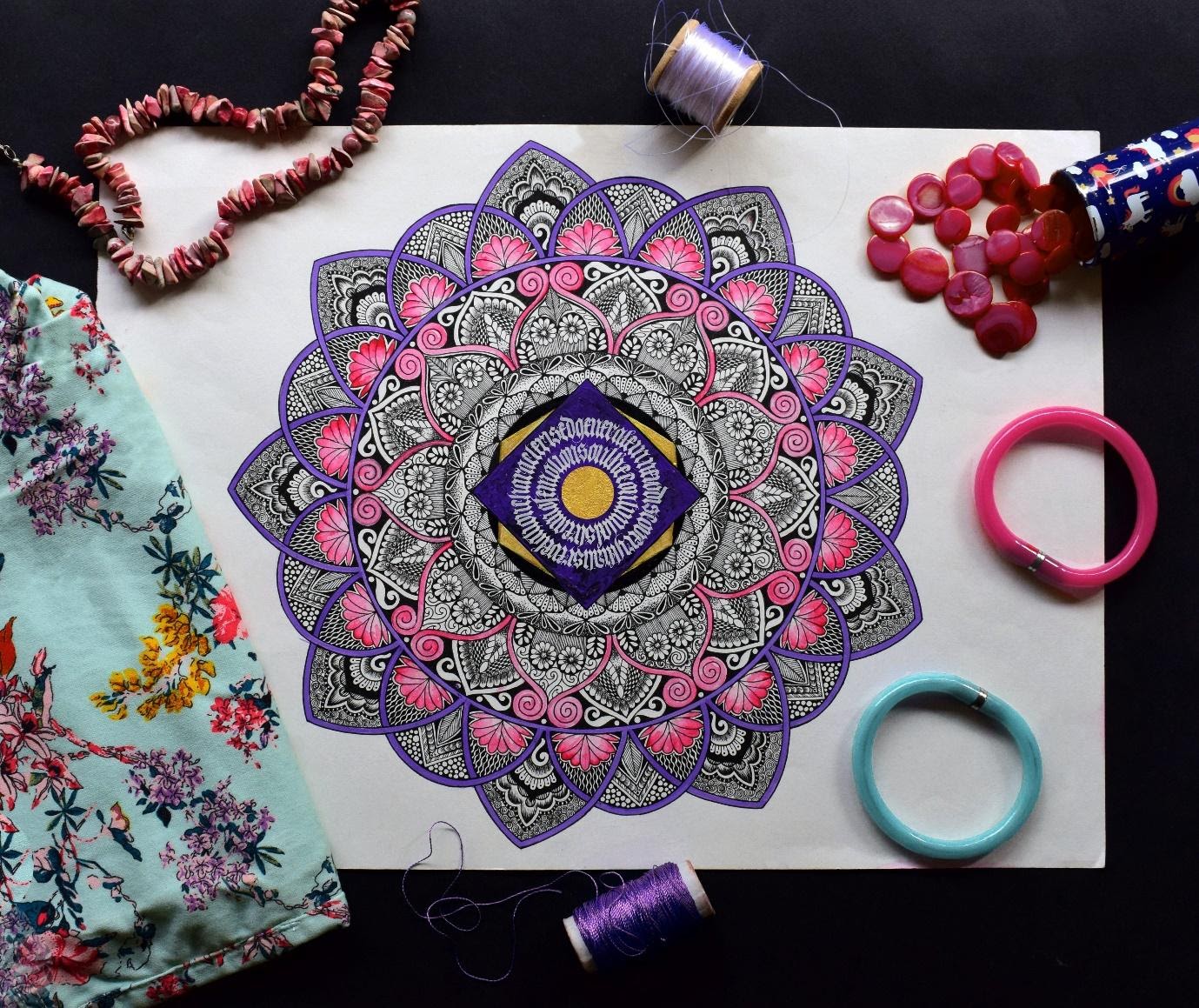 A mandala drawn and colored in on a sheet of paper