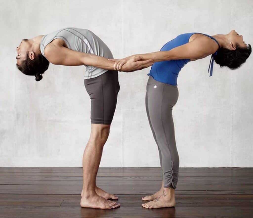 partner yoga pose standing backbend