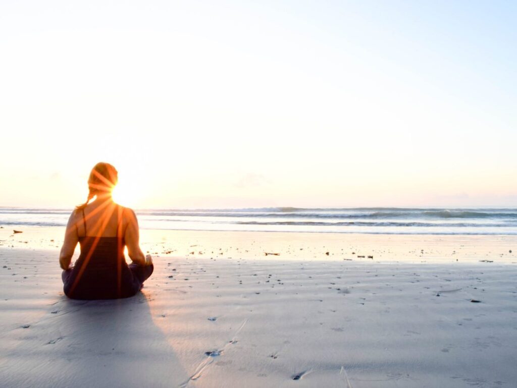 Woman finding clarity and peace during yoga teacher training retreat