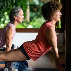 two women doing upward facing dog yoga pose in Blue Osa's Yoga Shala in Costa Rica.
