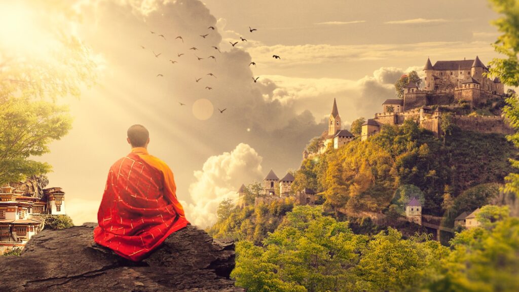 Buddhist monk sitting on a rock in traditional orange robe over looking an ancient city with birds and clouds. 