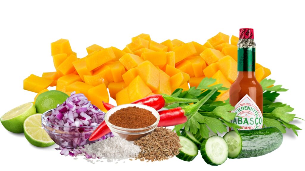 Image of ingredients for the mango salsa: mangos, limes, red onion, cumin, salt, jalapenos, cilantro, cucumbers and tabasco sauce. 