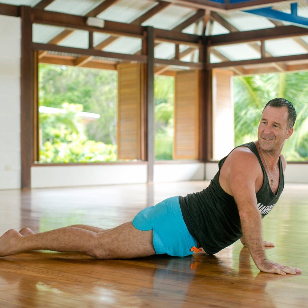 Yogi Aaron in a twisted cobra pose.