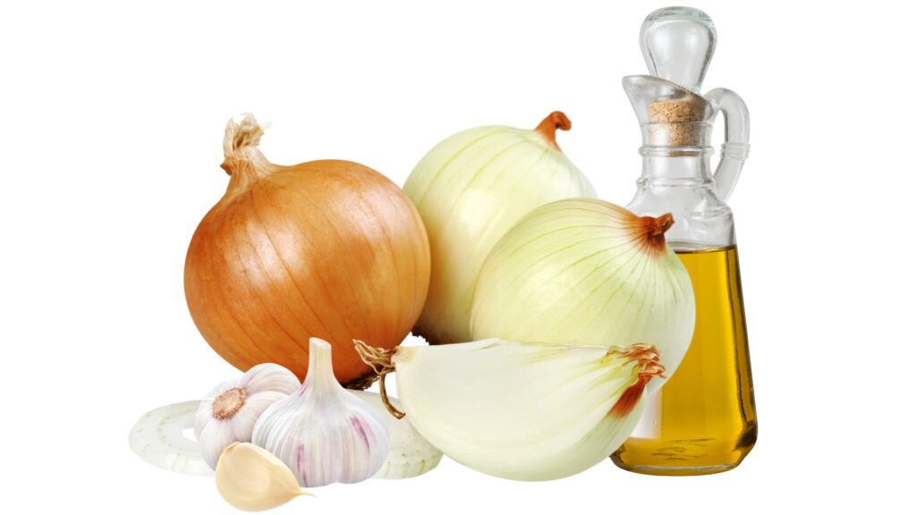 White onions, garlic and olive oil with a white background.