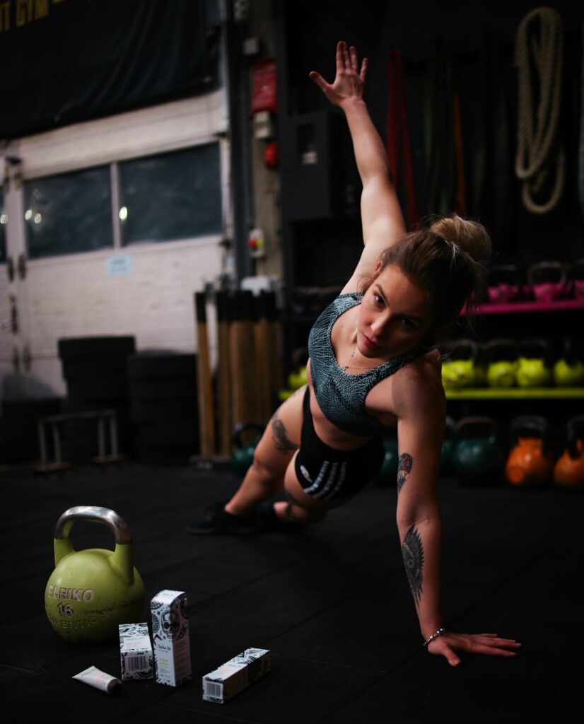 woman exercising in gym HIIT fitness wellness trend