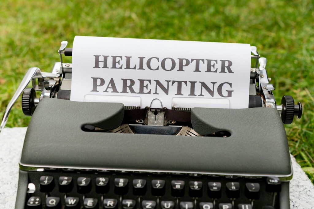 a close up of a typewriter with a paper on it helicopter parenting five kleshas yoga philosophy yoga for personal transformation yoga to overcome fears