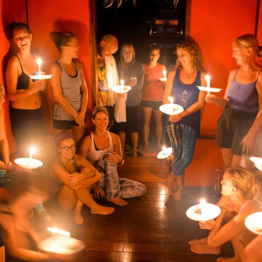 Students-standing-with-candles-Blue-Osa-Yoga-Retreat-What-Everybody-Ought-to-Know-About-Blue-Osas-Immersion-Style-Yoga-Teacher-Training-Program